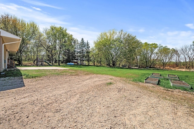 7349 Variolite Dr NW, Stanford Twp, MN 55398 - surrounding community with a yard and view of scattered trees