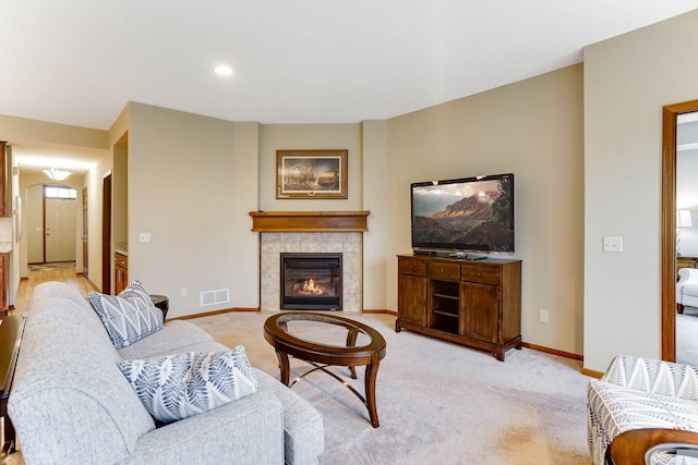 8713 9th Pl N, Lake Elmo, MN 55042 - living area with a tiled fireplace, light colored carpet, and recessed lighting