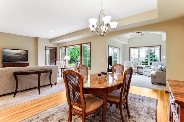 8713 9th Pl N, Lake Elmo, MN 55042 - dining space featuring arched walkways, light wood-style flooring, plenty of natural light, a chandelier, and recessed lighting