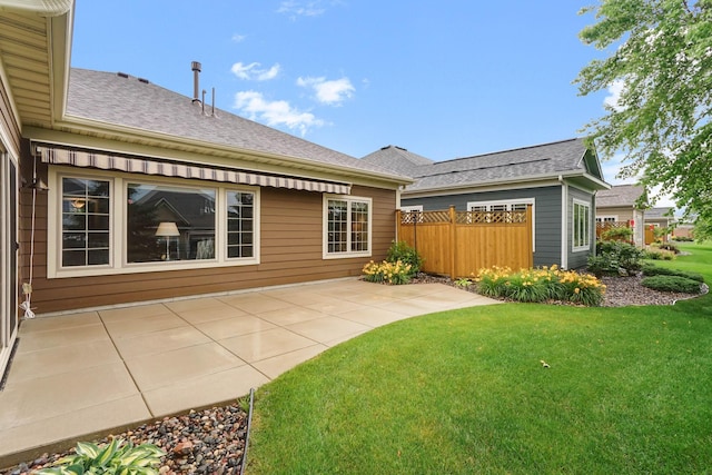 8713 9th Pl N, Lake Elmo, MN 55042 - rear view of house featuring a patio area and roof with shingles
