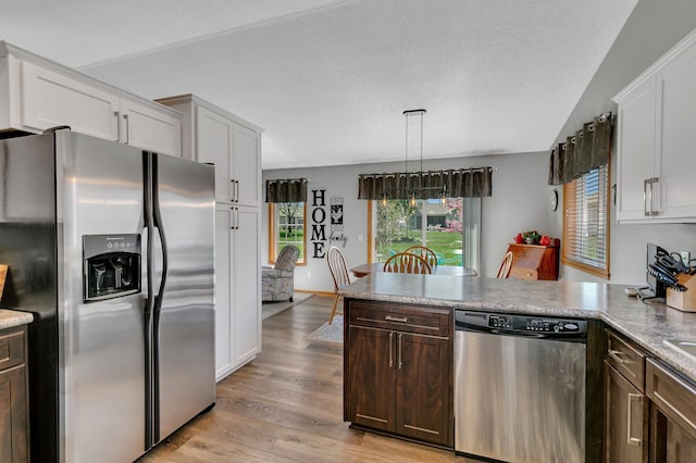 223 Glenview Loop, Saint Cloud, MN 56303 - kitchen featuring stainless steel appliances, a peninsula, light wood finished floors, light countertops, and white cabinets