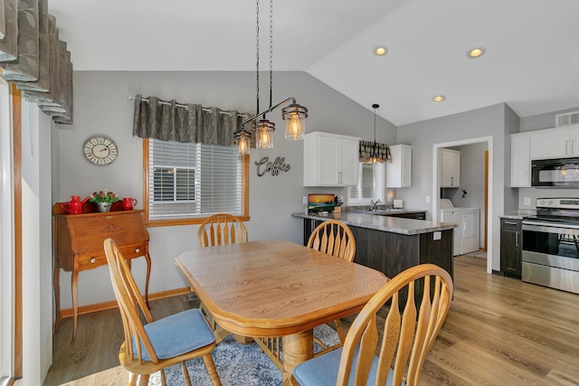 223 Glenview Loop, Saint Cloud, MN 56303 - dining space featuring separate washer and dryer, light wood-style flooring, lofted ceiling, recessed lighting, and baseboards