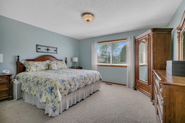 223 Glenview Loop, Saint Cloud, MN 56303 - bedroom featuring light colored carpet, a textured ceiling, and baseboards