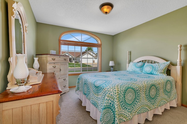 223 Glenview Loop, Saint Cloud, MN 56303 - carpeted bedroom featuring a textured ceiling and baseboards
