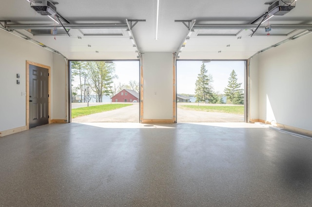 3391 Little Ida Beach Rd NW, Alexandria, MN 56308 - garage with baseboards and a garage door opener