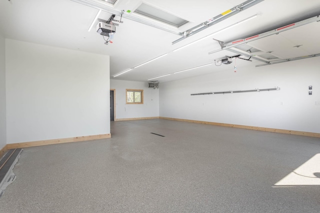 3391 Little Ida Beach Rd NW, Alexandria, MN 56308 - garage with baseboards and a garage door opener