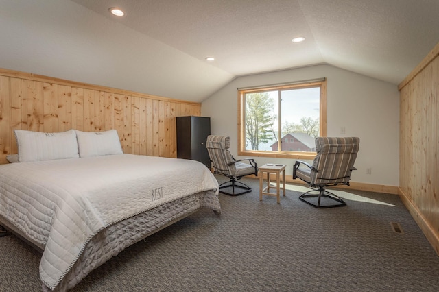 3391 Little Ida Beach Rd NW, Alexandria, MN 56308 - bedroom with vaulted ceiling, carpet floors, wood walls, recessed lighting, and baseboards