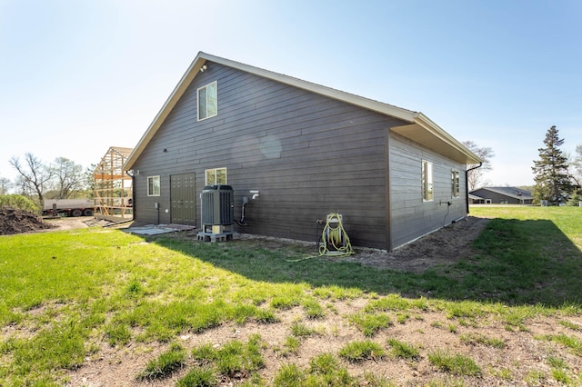 3391 Little Ida Beach Rd NW, Alexandria, MN 56308 - view of side of home featuring central AC unit and a yard