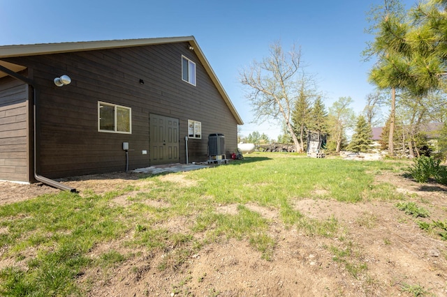3391 Little Ida Beach Rd NW, Alexandria, MN 56308 - rear view of property featuring central AC and a lawn