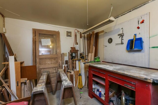 1811 Elliot Ave Unit 2, Minneapolis, MN 55404 - miscellaneous room with a workshop area and unfinished concrete floors