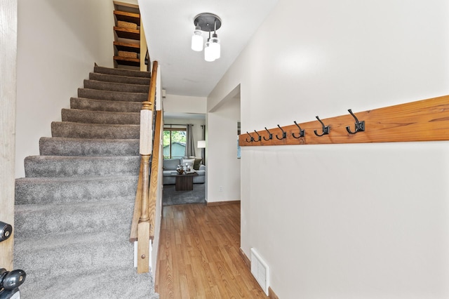 13501 Heather Hills Dr, Burnsville, MN 55337 - stairs featuring wood finished floors