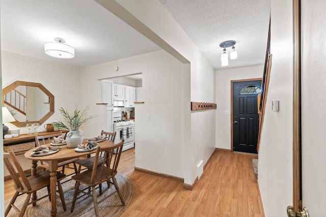13501 Heather Hills Dr, Burnsville, MN 55337 - entrance foyer with light wood-style floors and baseboards