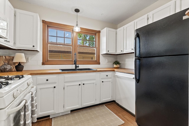 13501 Heather Hills Dr, Burnsville, MN 55337 - kitchen with white appliances, a sink, and white cabinetry