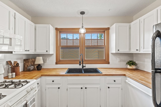 13501 Heather Hills Dr, Burnsville, MN 55337 - kitchen featuring white appliances, a sink, a textured ceiling, and white cabinets
