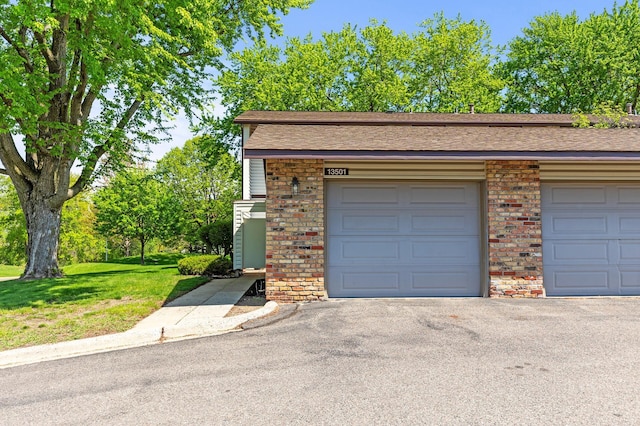 13501 Heather Hills Dr, Burnsville, MN 55337 - garage featuring asphalt driveway