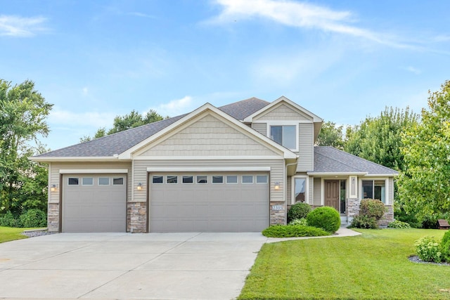 craftsman inspired home with an attached garage, stone siding, driveway, and a front lawn