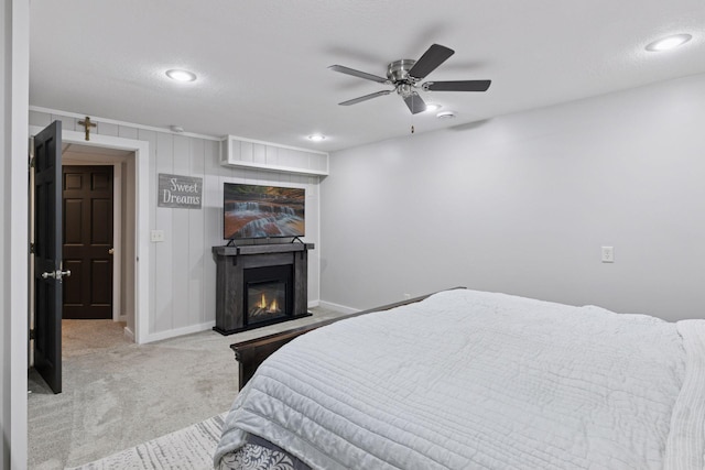 14530 Jonathan Carver Pkwy, Carver, MN 55315 - bedroom featuring carpet flooring, a glass covered fireplace, baseboards, recessed lighting, and ceiling fan