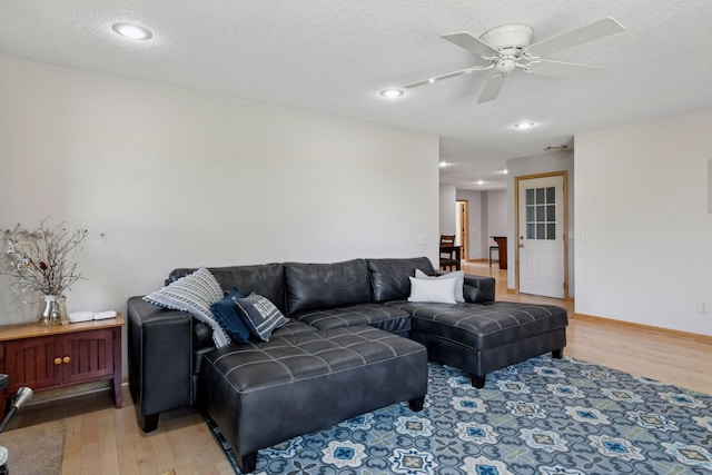 14530 Jonathan Carver Pkwy, Carver, MN 55315 - living area with light wood-style flooring, a ceiling fan, recessed lighting, and a textured ceiling