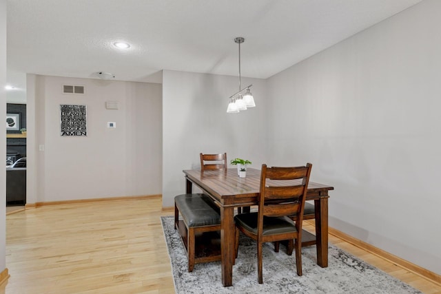 14530 Jonathan Carver Pkwy, Carver, MN 55315 - dining space featuring light wood finished floors, baseboards, and recessed lighting