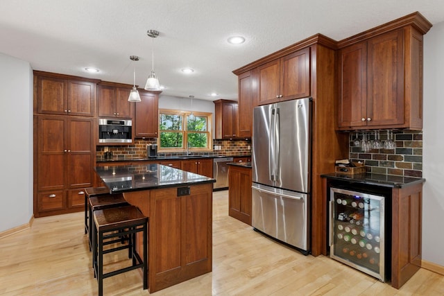 14530 Jonathan Carver Pkwy, Carver, MN 55315 - kitchen featuring appliances with stainless steel finishes, beverage cooler, a sink, light wood-style floors, and recessed lighting
