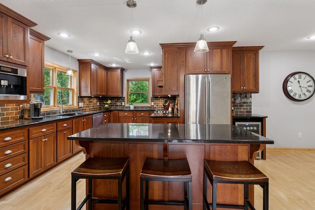 14530 Jonathan Carver Pkwy, Carver, MN 55315 - kitchen with stainless steel appliances, a sink, light wood-style flooring, plenty of natural light, and recessed lighting