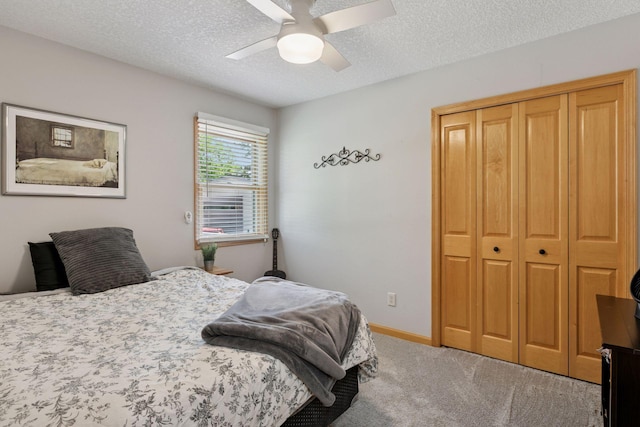14530 Jonathan Carver Pkwy, Carver, MN 55315 - bedroom with carpet, a closet, a textured ceiling, a ceiling fan, and baseboards