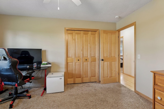 14530 Jonathan Carver Pkwy, Carver, MN 55315 - carpeted office with a textured ceiling, a ceiling fan, and baseboards