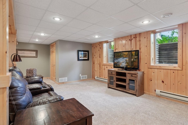 14530 Jonathan Carver Pkwy, Carver, MN 55315 - carpeted living area featuring a baseboard radiator, baseboards, wooden walls, a drop ceiling, and recessed lighting