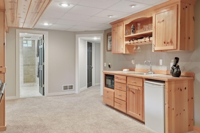 14530 Jonathan Carver Pkwy, Carver, MN 55315 - bar area featuring white dishwasher, a sink, black microwave, light colored carpet, and baseboards