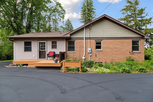 14530 Jonathan Carver Pkwy, Carver, MN 55315 - back of house featuring a wooden deck and brick siding