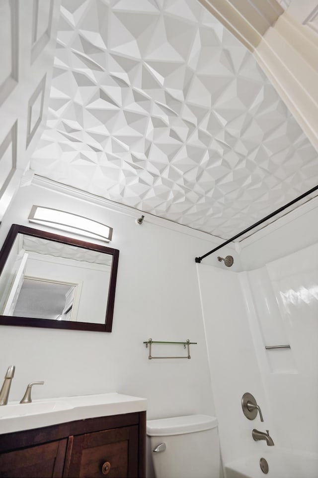 bathroom with toilet, vanity, and shower / bath combination