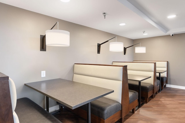 dining space with wood finished floors, baseboards, and recessed lighting
