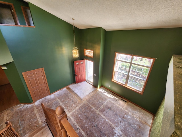 3458 Savannah Ave, White Bear Lake, MN 55110 - foyer featuring a textured ceiling and high vaulted ceiling