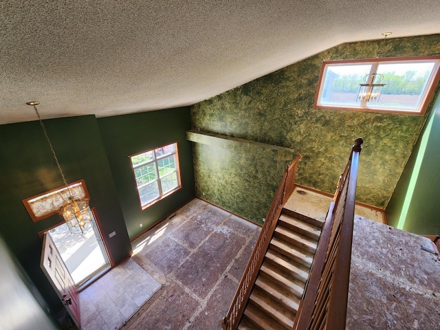 3458 Savannah Ave, White Bear Lake, MN 55110 - bonus room with vaulted ceiling, healthy amount of natural light, a textured ceiling, and a chandelier