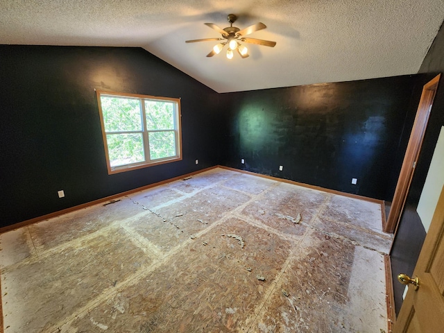 3458 Savannah Ave, White Bear Lake, MN 55110 - unfurnished room with ceiling fan, a textured ceiling, lofted ceiling, and baseboards