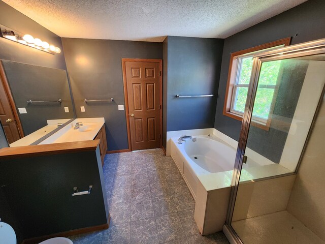 3458 Savannah Ave, White Bear Lake, MN 55110 - bathroom featuring a bath, a textured ceiling, a shower stall, vanity, and baseboards
