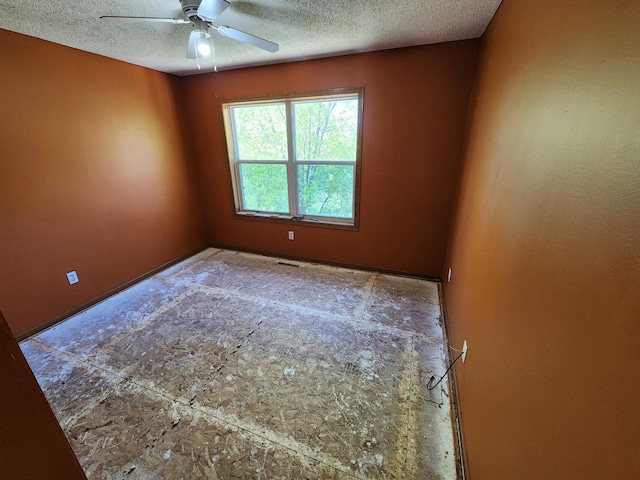 3458 Savannah Ave, White Bear Lake, MN 55110 - spare room with a textured ceiling, ceiling fan, and baseboards