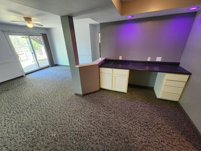 3458 Savannah Ave, White Bear Lake, MN 55110 - kitchen with white cabinets, dark countertops, and ceiling fan