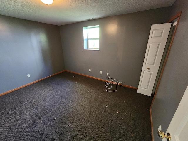 3458 Savannah Ave, White Bear Lake, MN 55110 - empty room featuring a textured ceiling, carpet floors, and baseboards