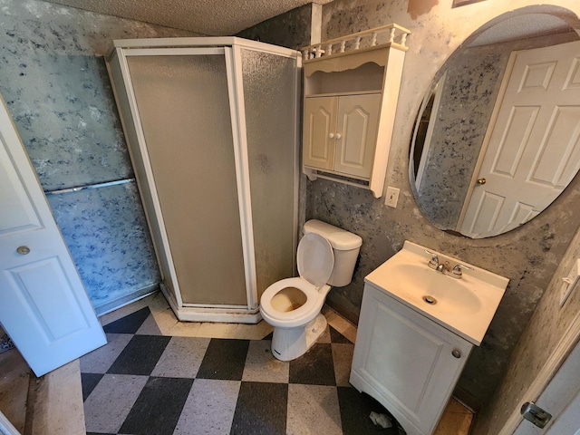 3458 Savannah Ave, White Bear Lake, MN 55110 - bathroom featuring tile patterned floors, a stall shower, toilet, and vanity