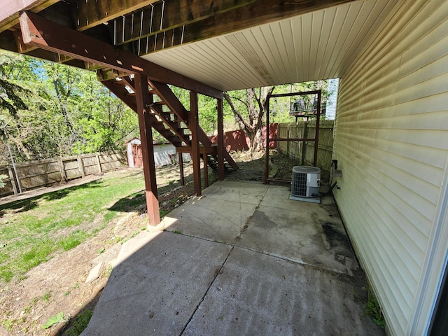 3458 Savannah Ave, White Bear Lake, MN 55110 - view of patio with a fenced backyard, central AC, a shed, an outbuilding, and stairway