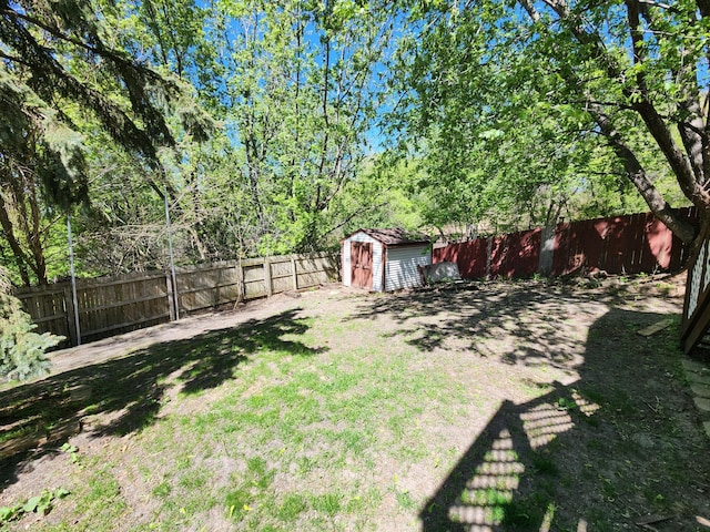 3458 Savannah Ave, White Bear Lake, MN 55110 - fenced backyard with a storage shed and an outdoor structure