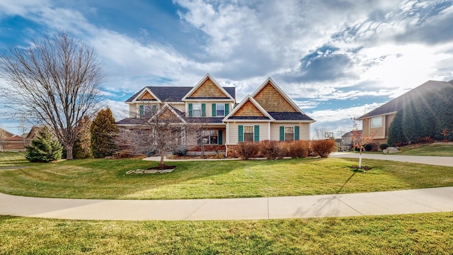 craftsman-style home with a front yard