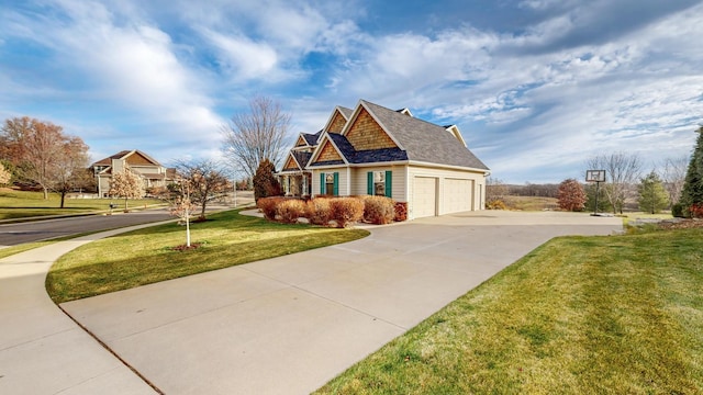view of front of property with a front lawn and concrete driveway