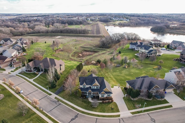 aerial overview of property's location featuring a nearby body of water and nearby suburban area