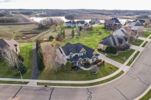 view of property location with a nearby body of water and nearby suburban area