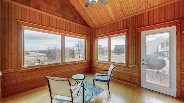 sunroom / solarium featuring lofted ceiling