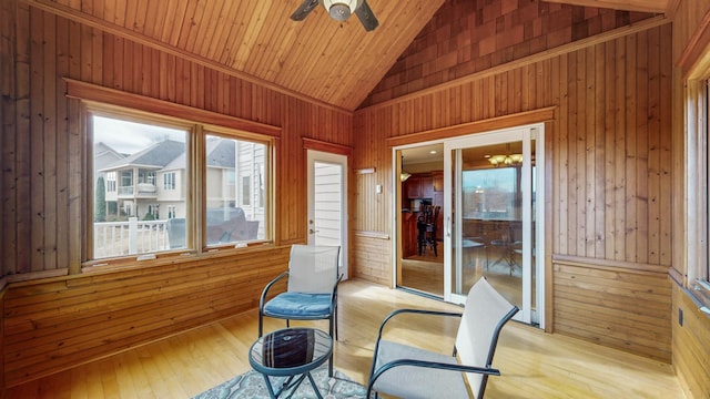 sunroom / solarium featuring lofted ceiling