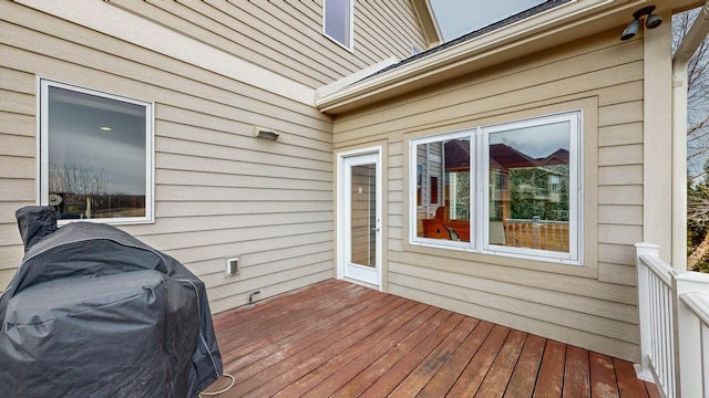 wooden terrace with a grill
