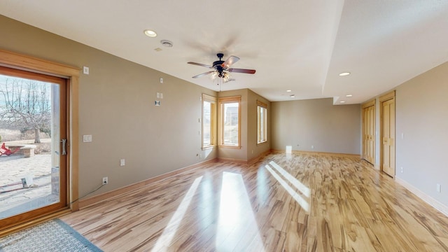 unfurnished living room featuring light wood-style floors, ceiling fan, baseboards, and recessed lighting